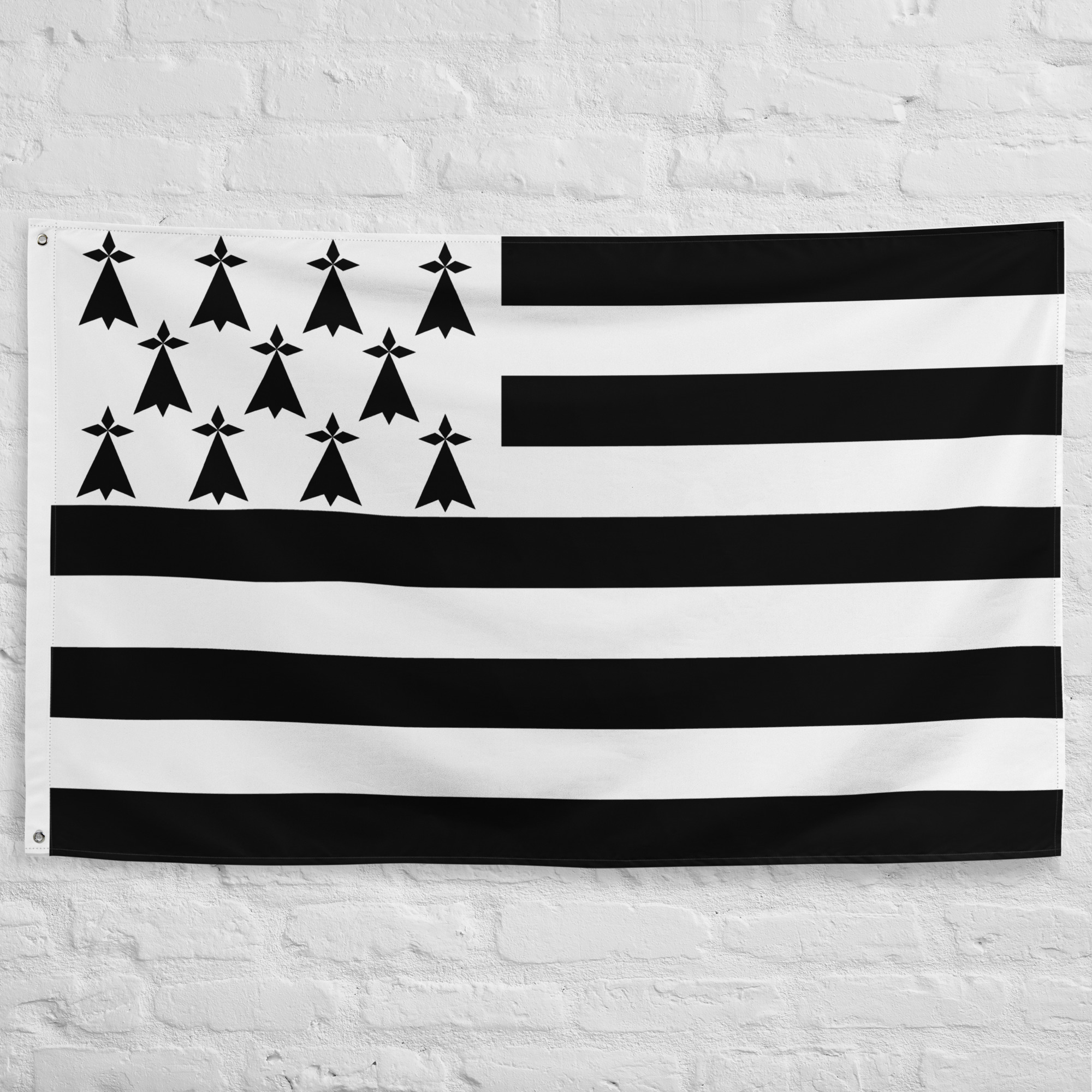 Breton Flag featuring black and white stripes and ermine symbols representing Brittany's Celtic heritage, culture, and regional identity in France.
